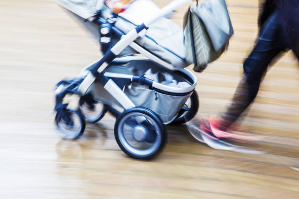 istock person with a baby buggy in motion blur 684542730
