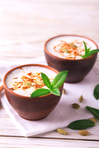 istock Traditional Indian lassi curd with cardamon, mint and saffron 684548394