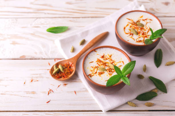 istock Traditional Indian lassi curd with cardamon, mint and saffron 684548552