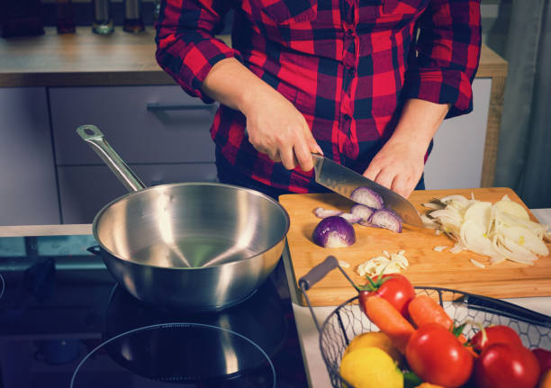 istock Young Woman Cooking at Home 684559034
