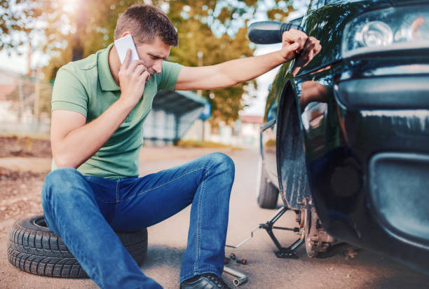 istock Problem with a car. A broken car on the road. Changing wheel 684565066
