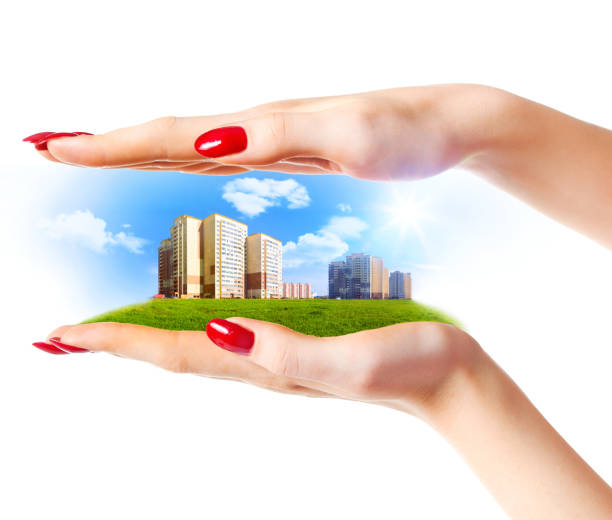 istock New buildings in woman hands 684565230