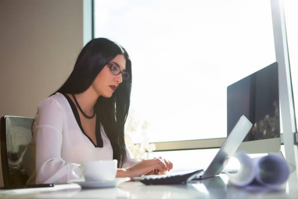 istock Business woman working on laptop computer 684575490