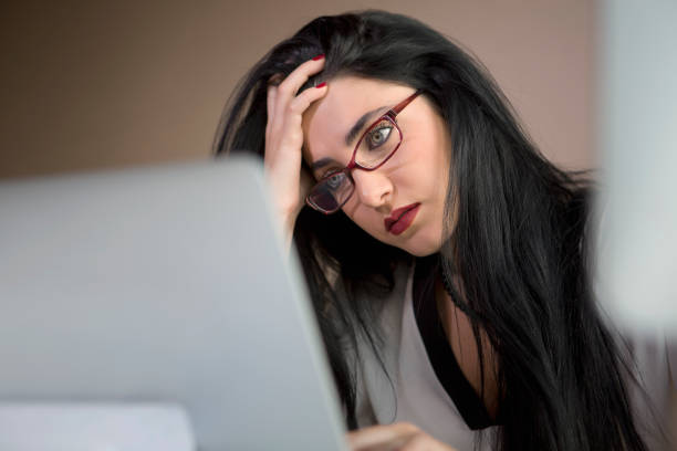 istock Tired woman in the office 684583892