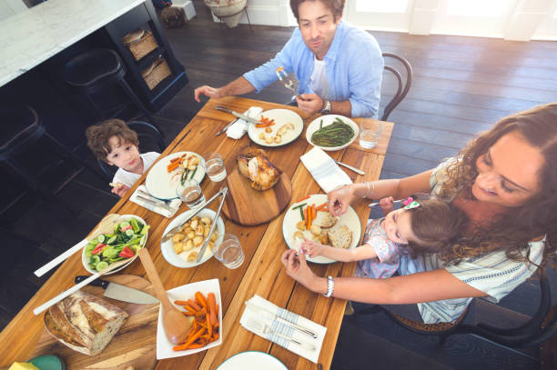 istock Family eating a meal at the table. 684595160