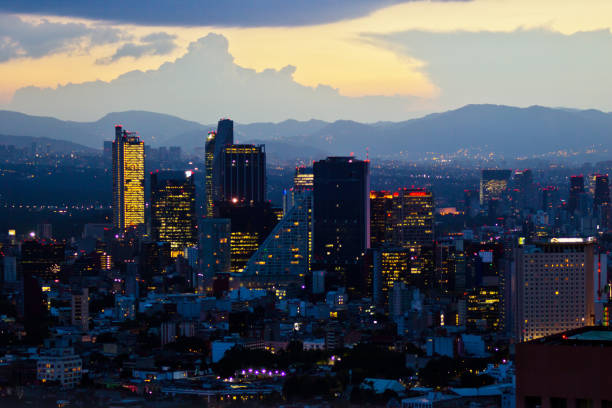 Mexico city at night MEXICO CITY,MEXICO-SEPTEMBER 14,2016: Aerial view of mexico city at sunset time before night. mexico city stock pictures, royalty-free photos & images