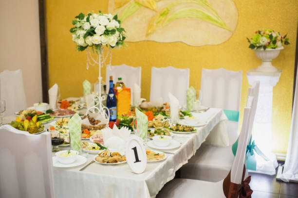 istock Decorated wedding table. Food on the table. Tableware. Empty glasses and wine glasses. Salad in a bowl. 684653268