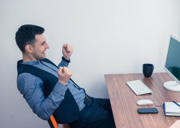 istock Happy young businessman showing success gesture 684653294