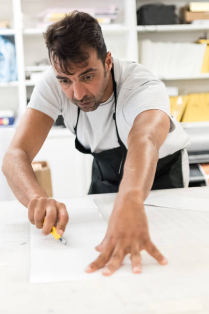 istock Mature man working at his printing shop 684655768
