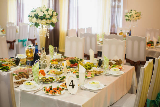istock Decorated wedding table. Food on the table. Tableware. Empty glasses and wine glasses. Salad in a bowl. 684658594