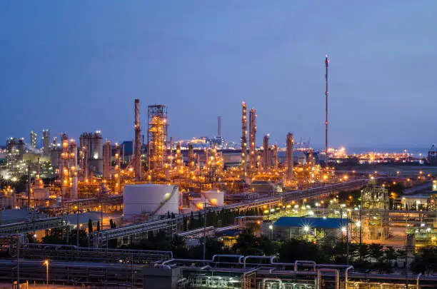 Photo of petrochemical plant at twilight with blue sky