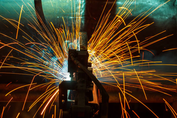 istock Welder robots movement in a car factory 684669076