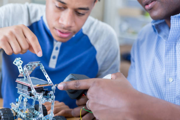 istock Father and son build robotic vehicle together 684677696