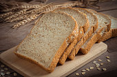 Whole wheat bread on wooden plate