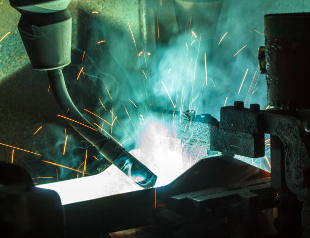 istock Welder robots movement in a car factory 684685612
