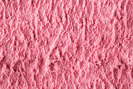 Fruit pink ice cream texture background macro shot