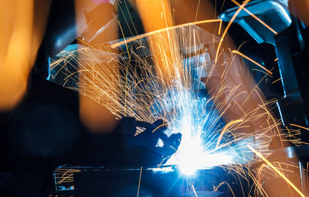 istock worker with protective mask welding metal 684696140