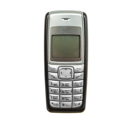 Old cellular mobile phone isolated on white background