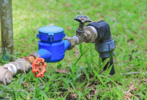 istock Water meter valve.  tap pipe  on floor grass, with copy space for add text 684701140