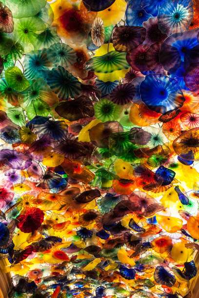 Glass Flowers Glass flowers on the ceiling of the Bellagio Hotel in Las Vegas bellagio ceiling stock pictures, royalty-free photos & images