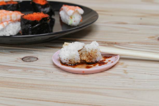 istock sushi kelp close up using of chopsticks 684703716