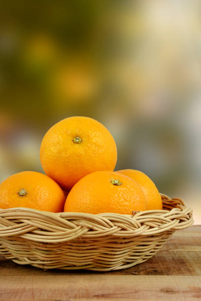 istock Oranges fruit in basket on wooden. 684706384
