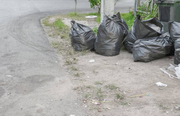 istock Pile black garbage bag roadside in the city close up 684706730