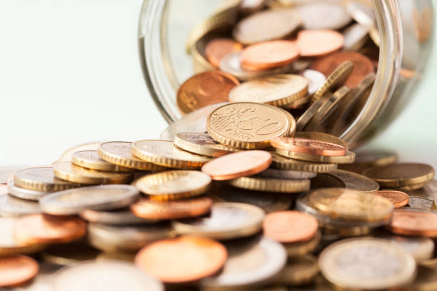istock Euro coins in a glass jar 684714650