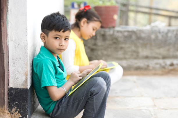 istock Boy and girl writing on slate 684715346