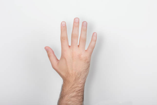 and holding out five fingers isolated on a white background