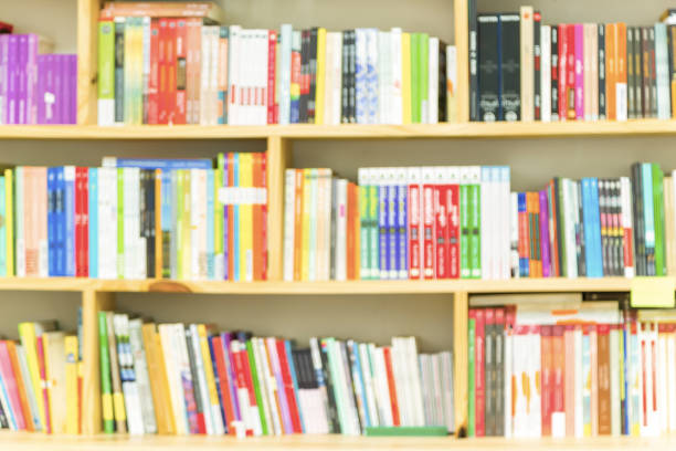 istock Books on bookshelf in library room, abstract blur de focused background. 684723944