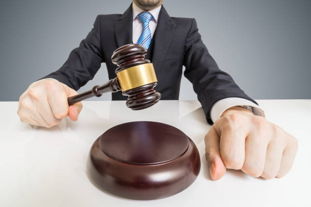 young man in suit with gavel. auction or justice concept. - gavel judge human hand court imagens e fotografias de stock