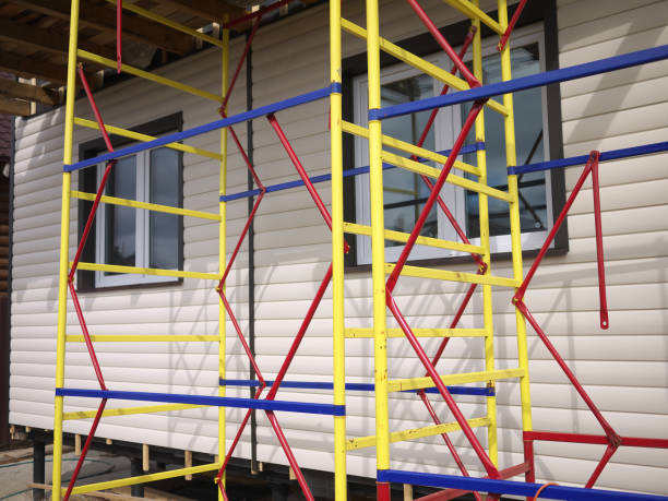 istock repaired rural house, fixed facade, waterproofing wood house by vinyl plasting siding 684732344