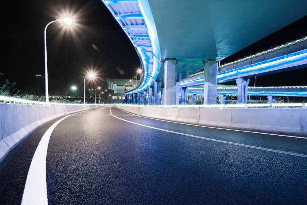 istock Empty road floor with city overpass viaduct bridge 684740922