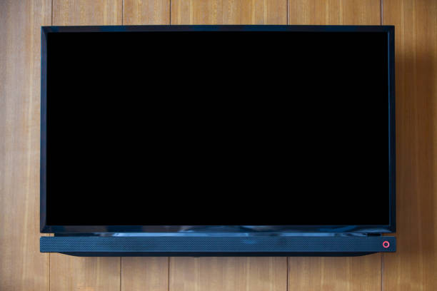 istock TV on wood background. 684744878
