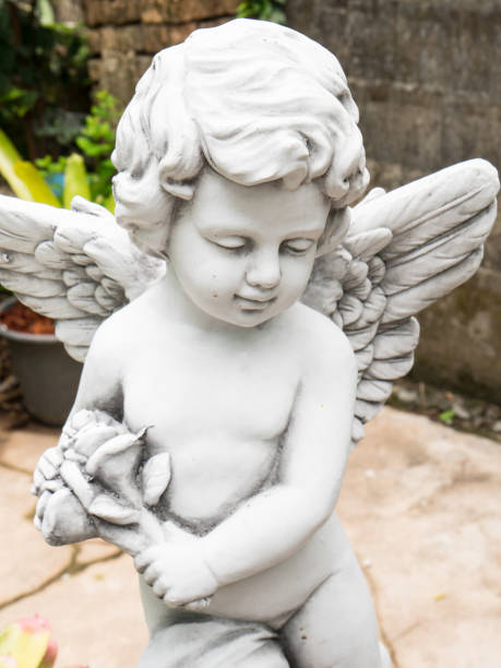 istock Little cupid statue in the garden 684754148