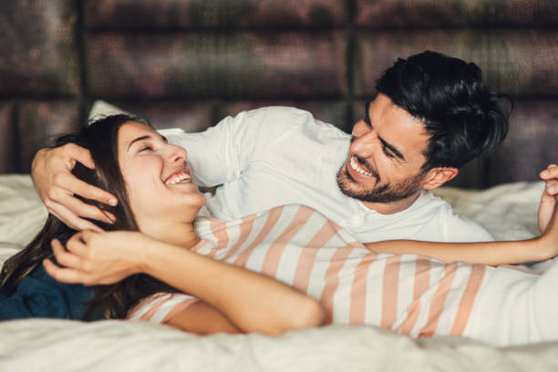 istock Happy young couple in bed 684757966