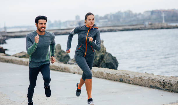 istock Friends jogging by the sea 684757978