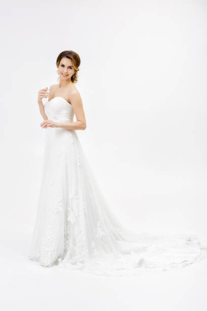 istock beautiful happy bride in wedding dress on white background 684760704