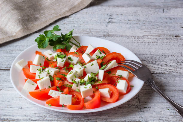 istock Fresh salad with tomato, mozzarella and herbs. 684764440