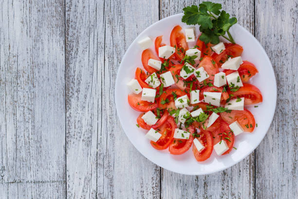 istock Fresh salad with tomato, mozzarella and herbs. 684764460