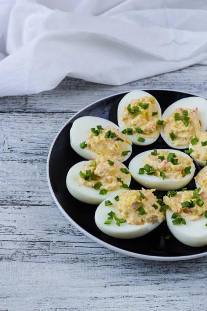 istock Home eggs stuffed with cheese and crab topped with green onions 684764914