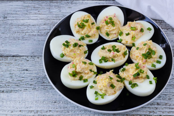 istock Home eggs stuffed with cheese and crab topped with green onions 684764920