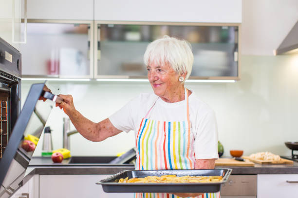 istock Senior woman cooking in the kitchen 684770794