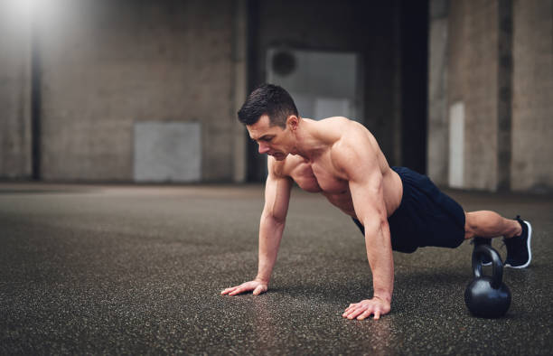 istock Full length shot of man doing push-ups 684771110
