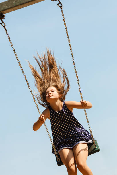 istock Playful crazy girl on swing. 684774752