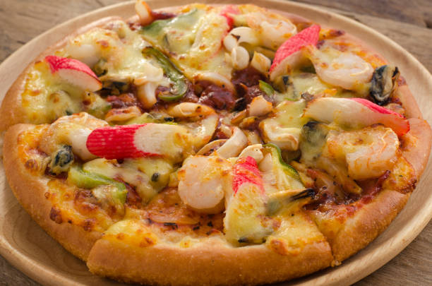 istock Pizza Seafood on wooden table ready to eat. 684785652