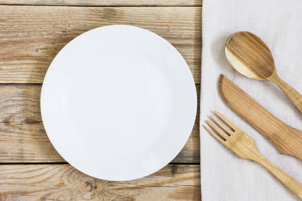 istock Wooden cutlery and empty plate on the Table 684790314