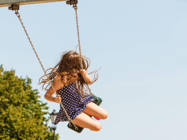 istock Playful crazy girl on swing. 684790370
