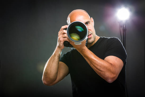 istock Young, pro male photographer in his studio 684793082